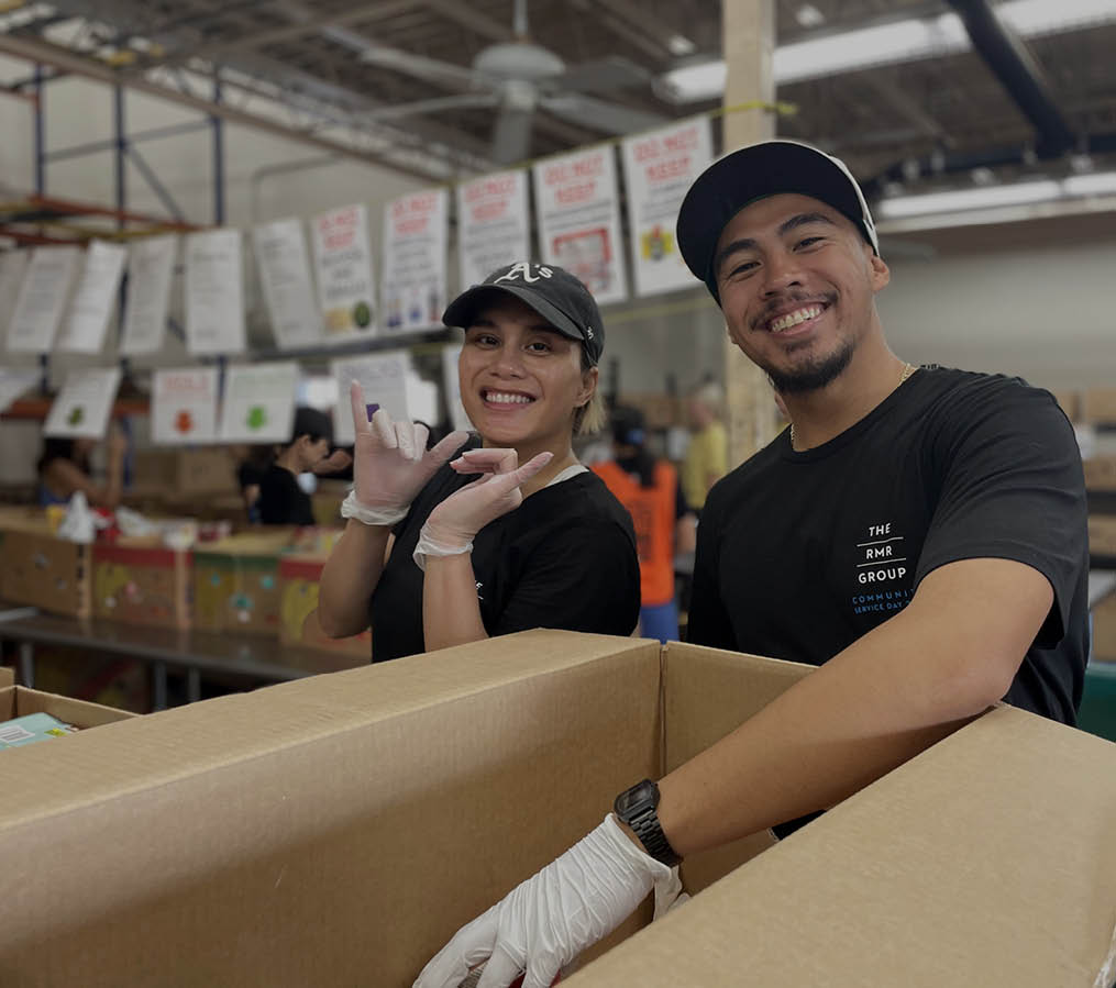 Holly Marcs, Administrative Assistant and Marvin Taeza, Assistant Property Manager volunteer at the Hawaii Foodbank as part of RMR’s 2023 Community Service Day.