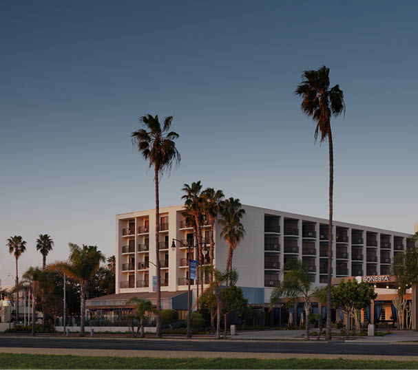 Sonesta Redondo Beach and Marina with the address of 300 North Harbor Drive is a white building with many balconies and covered front entrance in Redondo Beach, California. The building is owned by SVC and operated by Sonesta and is ENERGY STAR Certified.