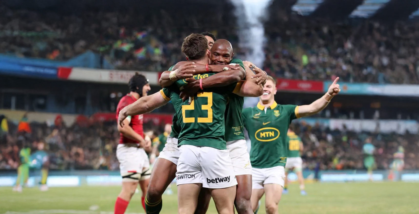 Rugby players on a grass field
