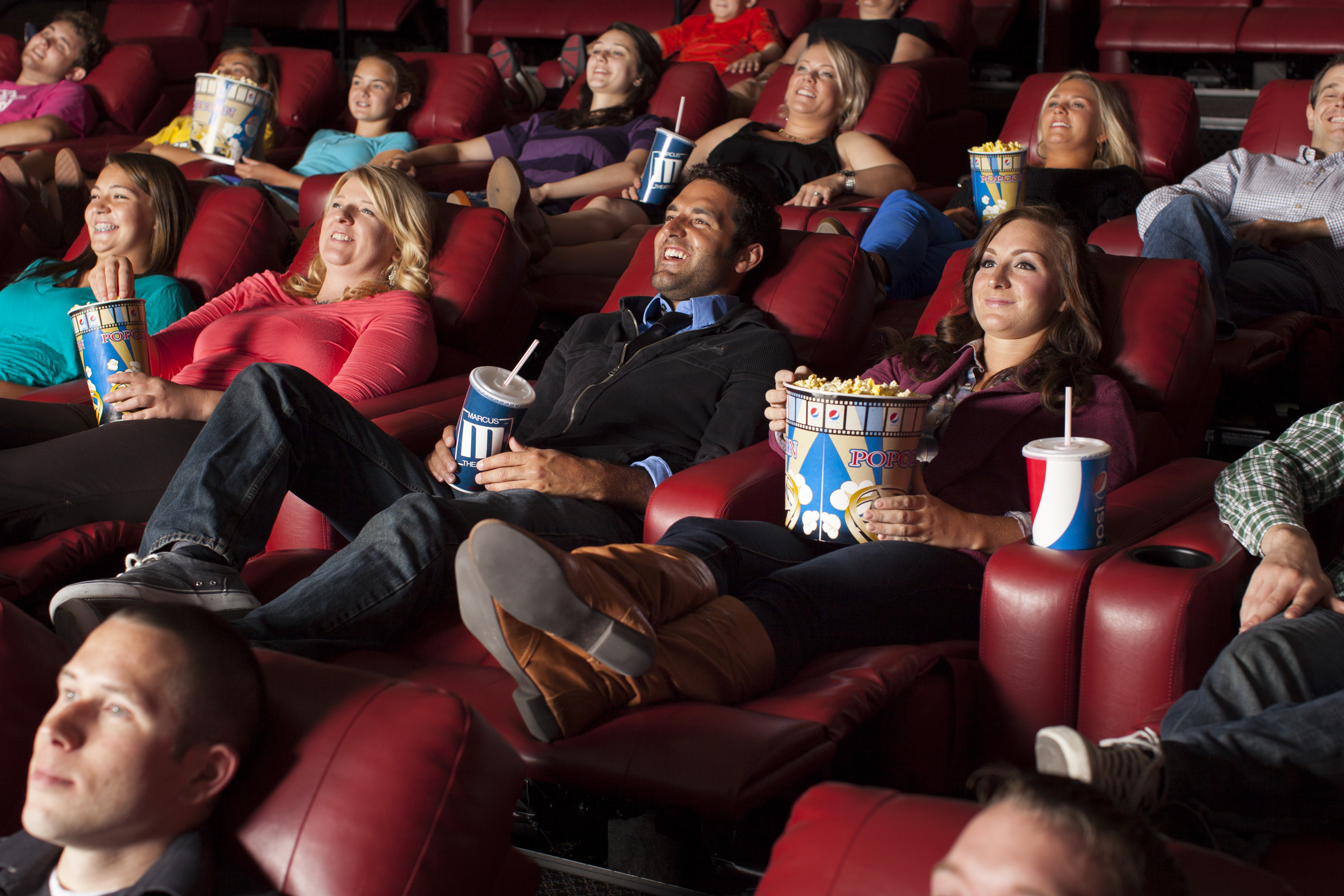 Company profile image couple and crowd in a cinema